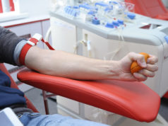 Preparing for taking blood from the vain. Arm pressing a ball for better blood pressure